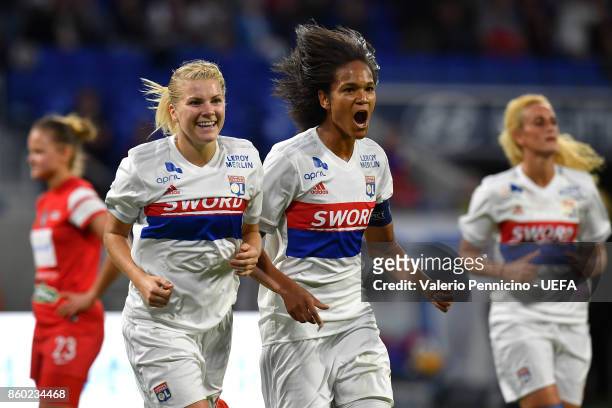 Wendie Renard of Lyon celebrates a goal with team mate Ada Hegerberg during the UEFA Women's Champions League Round of 32 Second Leg match between...