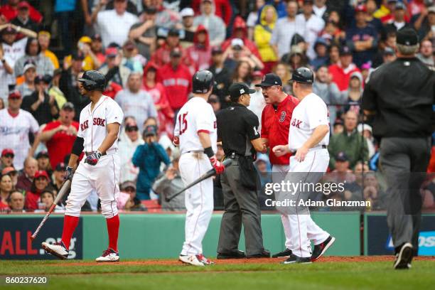 Manager John Farrell of the Boston Red Sox argues with home plate umpire Mark Wegner after Dustin Pedroia is called out on strikes in the second...