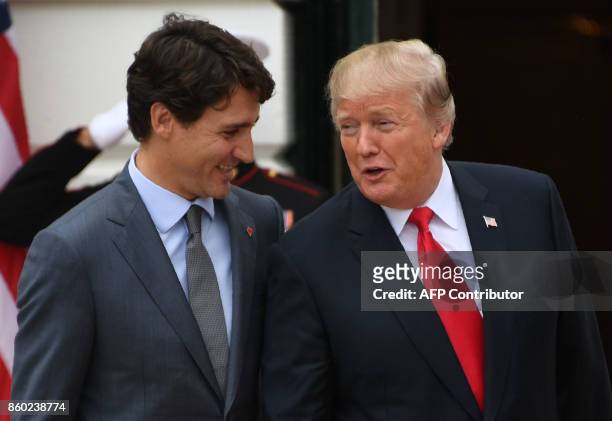 President Donald Trump welcomes Canadian Prime Minister Justin Trudeau at the White House in Washington, DC, on October 11, 2017 / AFP PHOTO / JIM...