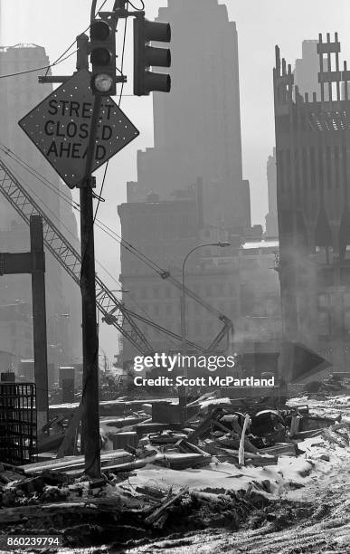 Construction cranes sit on snow covered dirt as Towers One and Two of the World Trade Center are erected in the winter of 1970 .