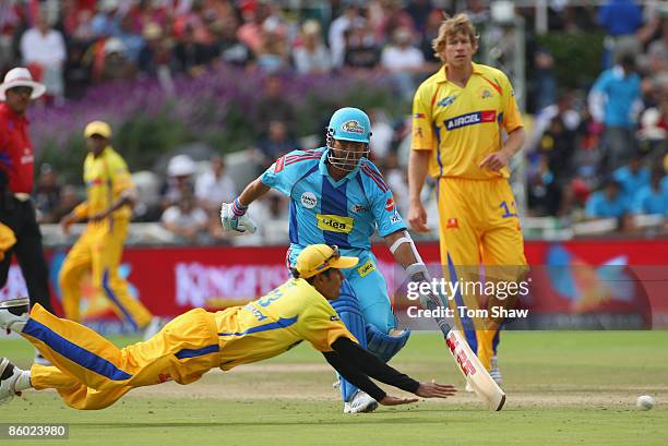 Subramaniam Badrinath of Chennai tries to run out Sachin Tendulkar of Mumbai during the IPL T20 match between Mumbai Indians and Chennai Super Kings...