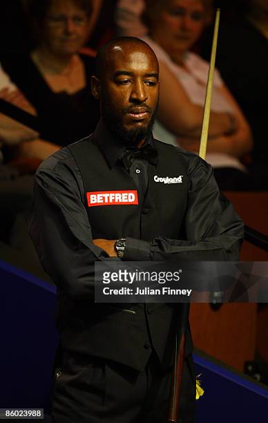 Rory McLeod of England looks on in his first round match against Mark King of England during the Betfred World Snooker Championships at the Crucible...