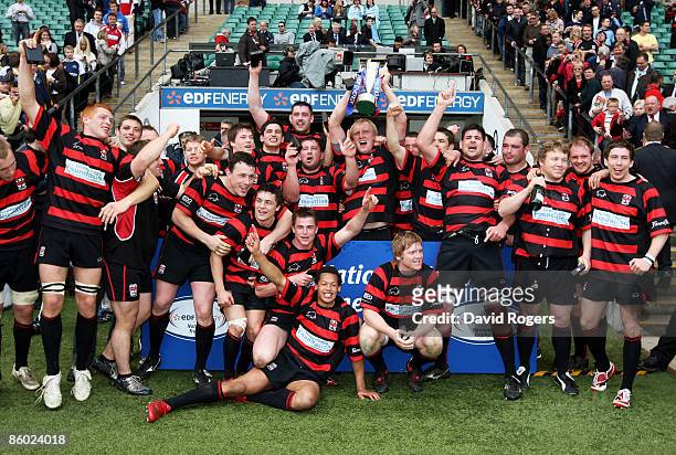 Moseley players celebrate with the trophy following their team's victory during the EDF Energy National Trophy Final between Leeds Carnegie and...