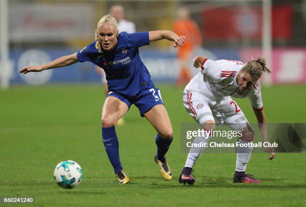 Verena Faisst of FC Bayern Muenchen fights for the ball with Maria Thorisdottir of Chelsea FC during the Champions League round of 32 second leg...