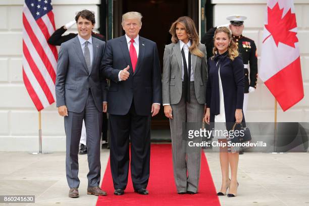 Canadian Prime Minister Justin Trudeau, U.S. President Donald Trump, first lady Melania Trump and Sophie Gregoire Trudeau pose for photographs at the...