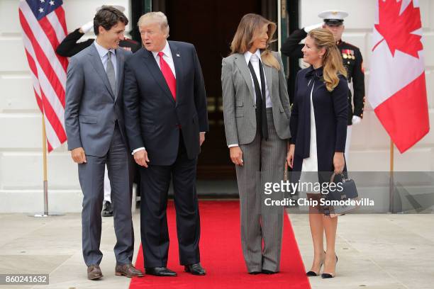 Canadian Prime Minister Justin Trudeau, U.S. President Donald Trump, first lady Melania Trump and Sophie Gregoire Trudeau pose for photographs at the...