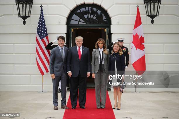 Canadian Prime Minister Justin Trudeau, U.S. President Donald Trump, first lady Melania Trump and Sophie Gregoire Trudeau pose for photographs at the...