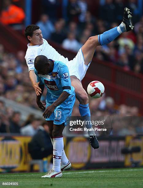 Gareth Barry of Aston Villa competes for the ball against Luis Boa Morte of West Ham during the Barclays Premier League match between Aston Villa and...