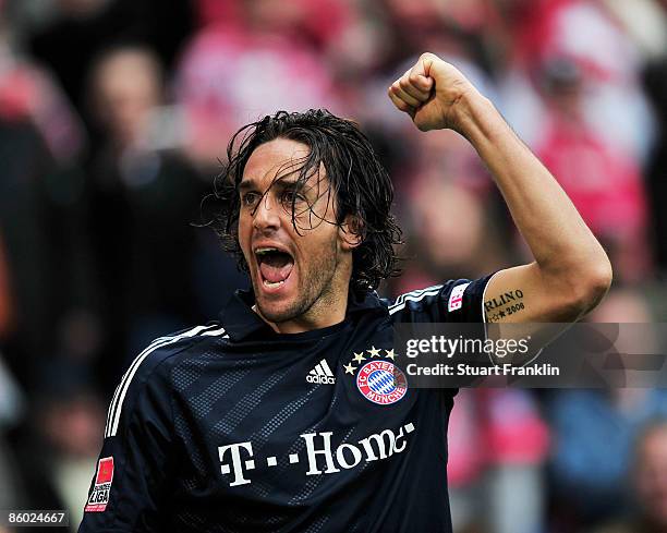 Luca Toni of Bayern celebrates scoring his first goal during the Bundesliga match between Arminia Bielefeld and FC Bayern Muenchen at the Schueco...