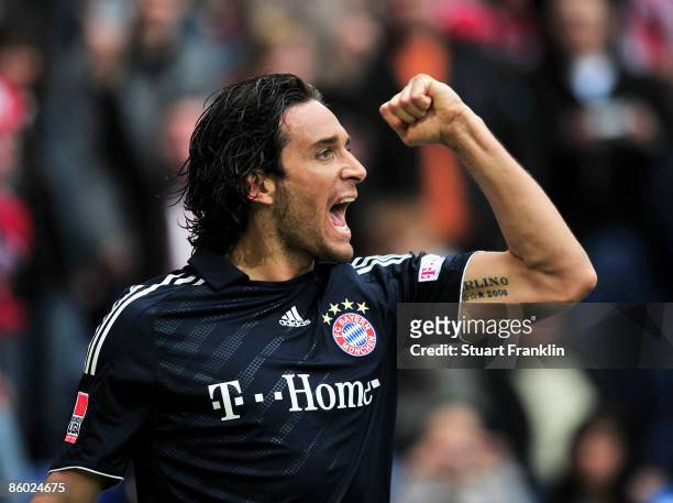 Luca Toni of Bayern celebrates scoring the first goal during the Bundesliga match between Arminia Bielefeld and FC Bayern Muenchen at the Schueco...