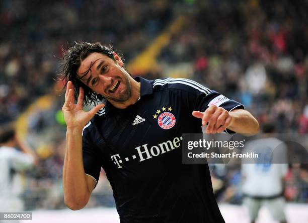 Luca Toni of Bayern celebrates scoring the first goal during the Bundesliga match between Arminia Bielefeld and FC Bayern Muenchen at the Schueco...