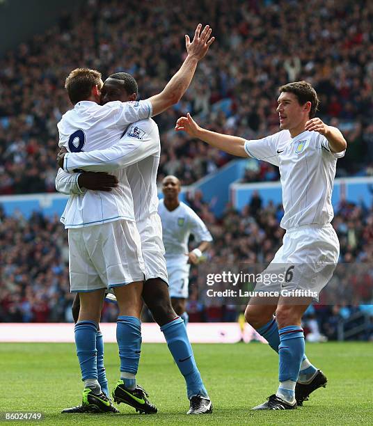 Emile Heskey of Aston Villa is congratualted on scoring the opening goal by James Milner and Gareth Barry during the Barclays Premier League match...