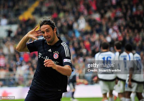 Luca Toni of Bayern celebrates scoring his first goal during the Bundesliga match between Arminia Bielefeld and FC Bayern Muenchen at the Schueco...