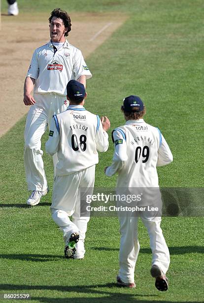 Jon Lewis of Gloucestershire celebrates taking the wicket of Laurie Evans of Surrey during the LV County Championship Division Two match between...