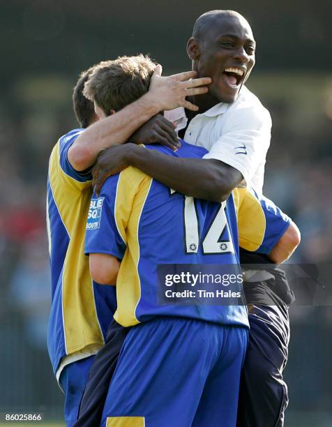 Wimbledon fans celebrate with Jon Main of AFC Wimbledon after the Blue Square Conference South match between Hampton and AFC Wimbledon at the Beveree...