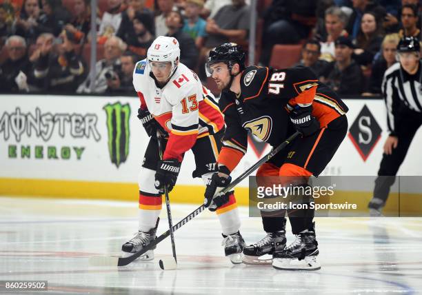 Calgary Flames Left Wing Johnny Gaudreau and Anaheim Ducks Winger Logan Shaw set up for a face off during an NHL game between the Calgary Flames and...