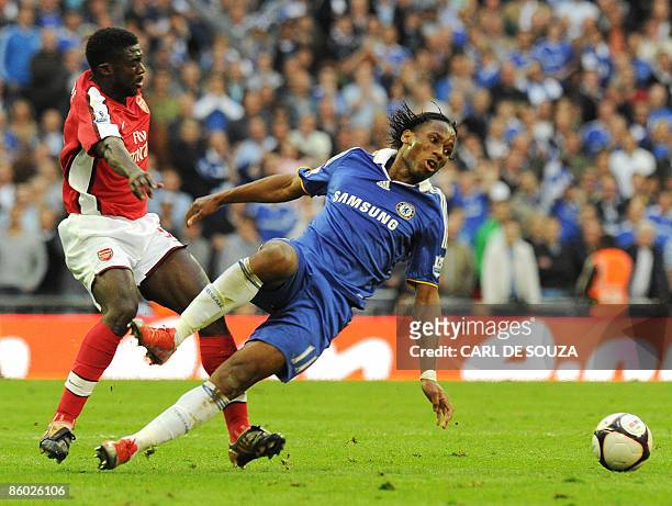 Chelsea's Didier Drogba vies with Arsenal's Ivorian defender Kolo Toure during the FA Cup Semi-Final football match at Wembley Stadium in London on...