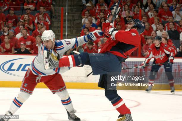 Alex Ovechkin of the Washington Capitals takes a hit during Game Two of the Eastern Conference Quarterfinals of the 2009 NHL Stanley Cup Playoffsfrom...