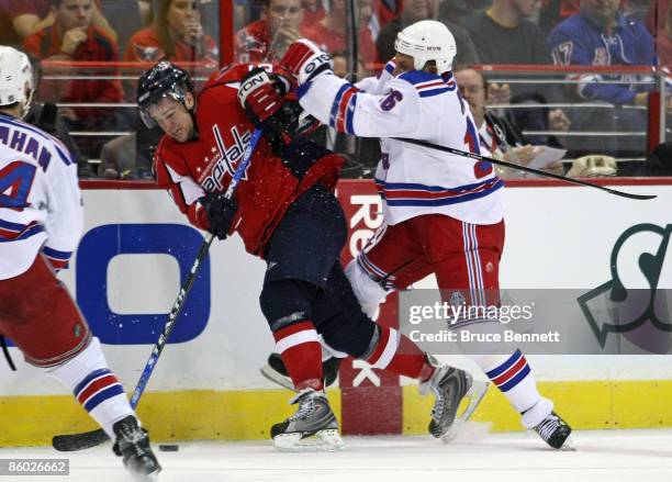 Sean Avery of the New York Rangers hits Mike Green of the Washington Capitals during Game Two of the Eastern Conference Quarterfinal Round of the...