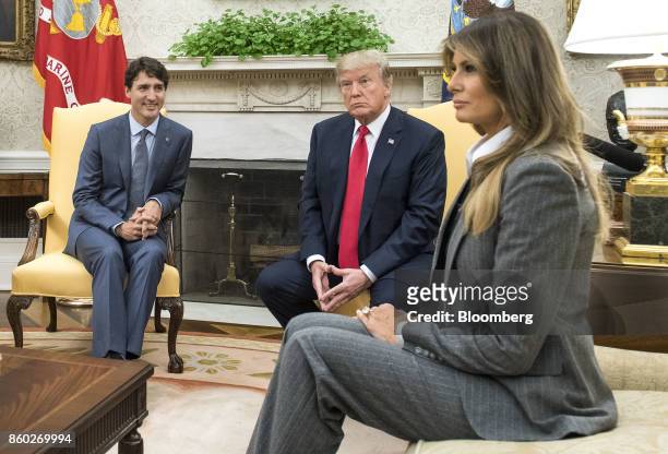 President Donald Trump, second right, and U.S. First Lady Melania Trump, right, meet with Justin Trudeau, Canada's prime minister, in the Oval Office...
