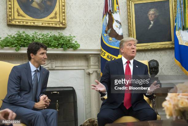 President Donald Trump, right, speaks as Justin Trudeau, Canada's prime minister, listens during a meeting in the Oval Office of the White House in...