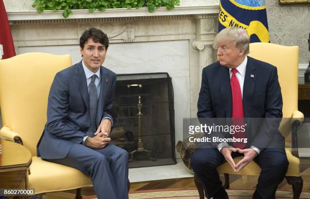 Justin Trudeau, Canada's prime minister, left, speaks as U.S. President Donald Trump listens during a meeting in the Oval Office of the White House...
