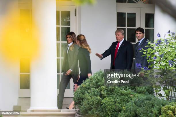 President Donald Trump , Canadian Prime Minister Justin Trudeau , First Lady Melania Trump and Sophie Gregoire Trudeau walk to the Oval Office for a...