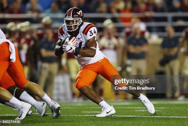 Travon McMillian of the Virginia Tech Hokies runs with the ball against the Boston College Eagles at Alumni Stadium on October 7, 2017 in Chestnut...