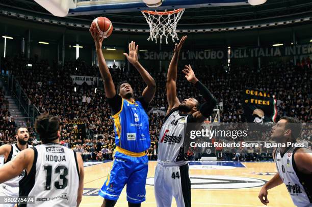 Damien Inglis of Betaland competes with Klaudio Ndoja and Marcus Slaughter and Alessandro Gentile of Segafredo during the LBA LegaBasket of Serie A1...