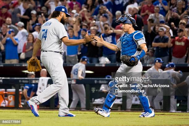 Kenley Jansen and Austin Barnes of the Los Angeles Dodgers celebrate after defeating the Arizona Diamondbacks in game three of the National League...