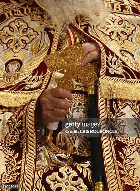 Pope Shenouda III, 85-years-old, the 117th Pope of the Coptic Orthodox Church of Alexandria and Patriarch of the Holy See of St. Mark, clutches a...