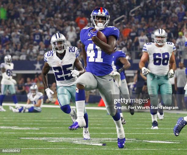 New York Giants cornerback Dominique Rodgers-Cromartie runs for touchdown in the second quarter after a fumble by the Dallas Cowboys' Cole Beasley on...