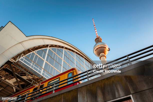 low angle view with tv tower and s-bahn - berlin fernsehturm stock-fotos und bilder