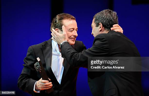 Actor Juan Diego receives from actor Antonio Banderas the "Malaga" Award at the Cervantes Theater during the 12th Malaga Film Festival on April 18,...