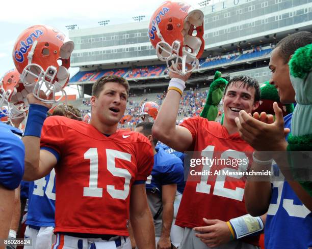 Quarterbacks Tim Tebow and John Brantley of the University of Florida celebrate after the spring football orange and blue game April 18, 2009 at Ben...