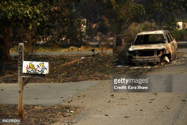 Car destroyed by the Tubbs Fire sits on the street on October 11, 2017 in Napa, California. In one of the worst wildfires in state history, more than...