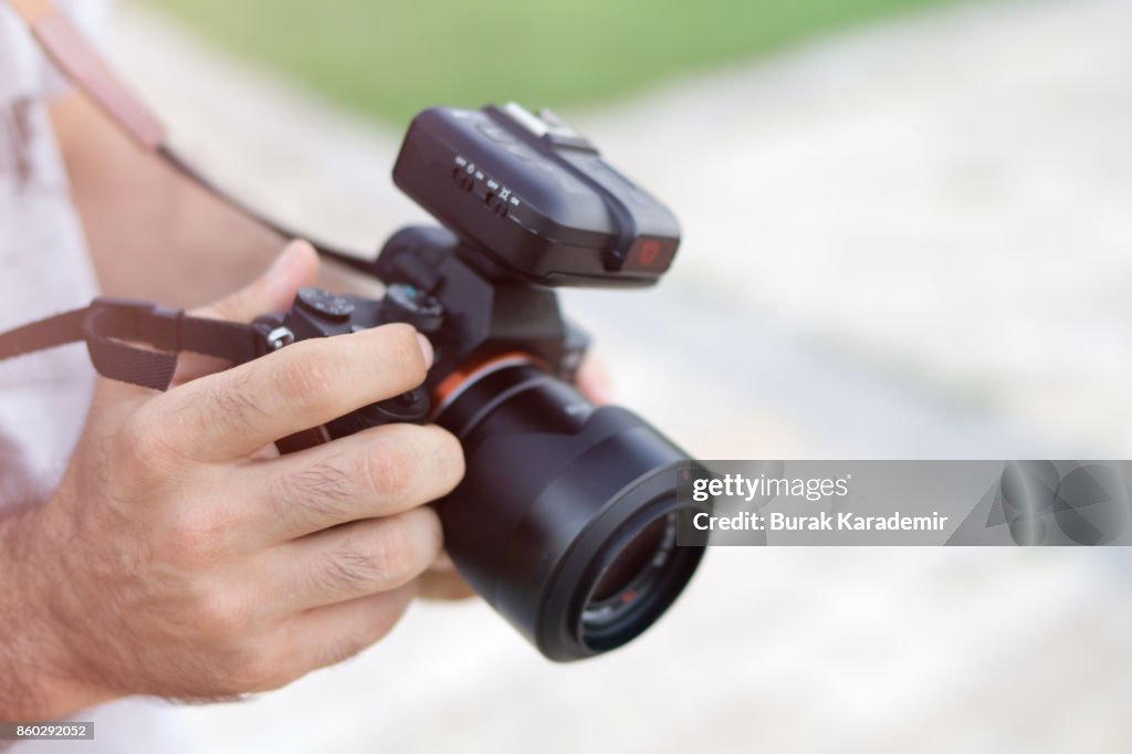 Young man holding camera