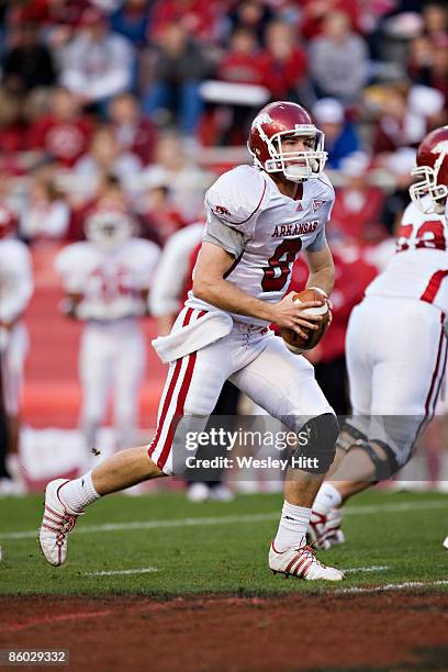 Tyler Wilson of the Arkansas Razorbacks White team looks downfield for a receiver during the Spring Red White game at Donald W. Reynolds Stadium on...