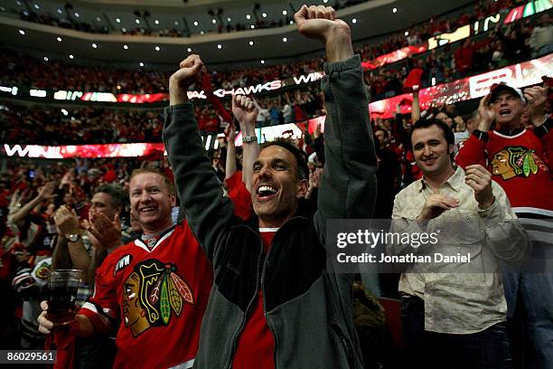 Fans of the Chicago Blackhawks celebrate after their 3-2 win against the Calgary Flames during Game Two of the Western Conference Quarterfinals of...