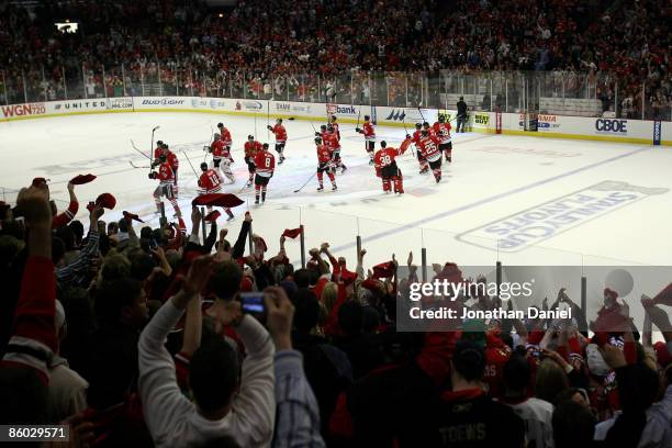 The Chicago Blackhawks and their fans celebrate after their 3-2 win against the Calgary Flames during Game Two of the Western Conference...