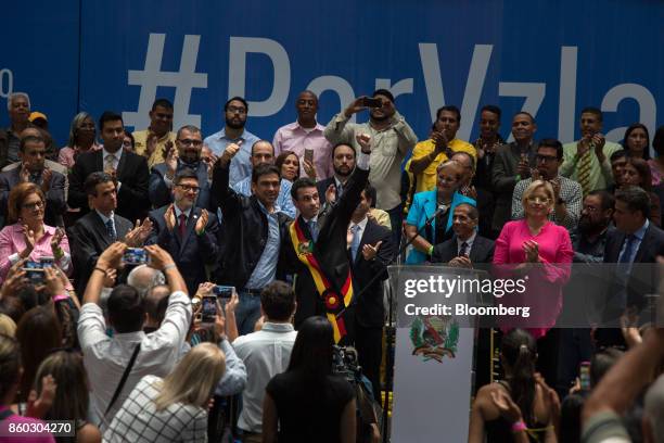 Henrique Capriles, opposition leader and governor of the State of Miranda, center left, gestures during an event marking his last day as governor in...