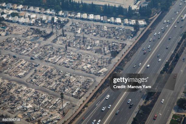 Aerial view of Journey End's Mobile home park, along the 101 freeway, destroyed by wildfire on October 11, 2017 in Santa Rosa, California.