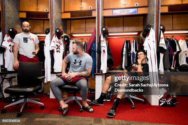 McFarland, Christian Walker and Anthony Banda of the Arizona Diamondbacks hang out in the clubhouse the day before game three of the National League...