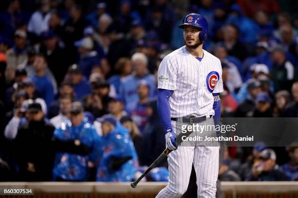 Kris Bryant of the Chicago Cubs walks back to the dugout after striking out in the sixth inning during game four of the National League Division...