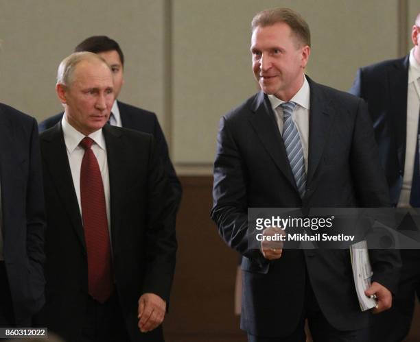 Russian President Vladimir Putin and First Deputy Prime Minister Igor Shuvalov enter the hall during the Summit of Eurasian Econonic Union October...