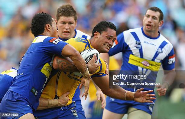 Weller Hauraki of the Eels is tackled during the round six NRL match between the Parramatta Eels and the Bulldogs at ANZ Stadium on April 19, 2009 in...