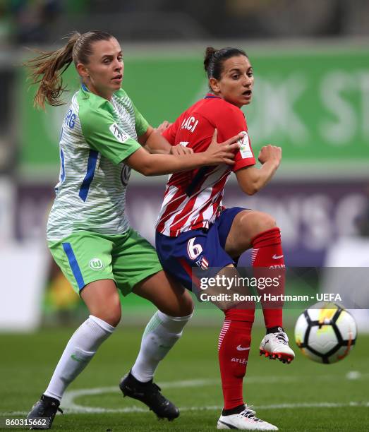 Noelle Maritz of Wolfsburg and Aurelie Kaci of Atletico Madrid compete during the UEFA Women Champions League Round of 32 second leg match between...