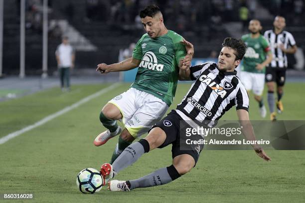 Igor Rabello of Botafogo battles for the ball with Alan Ruschel of Chapecoense during the match between Botafogo and Chapecoense as part of...