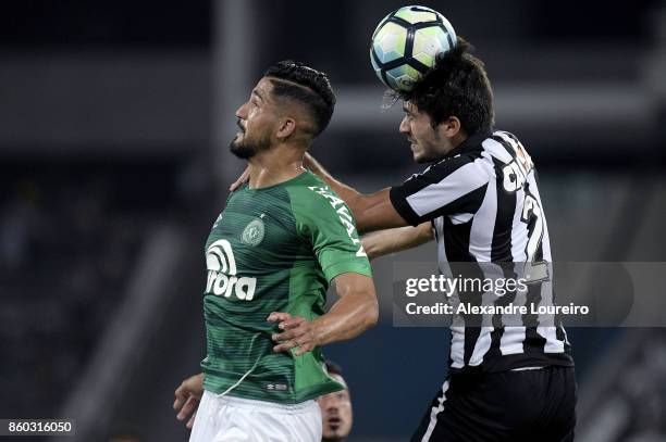 Igor Rabello of Botafogo battles for the ball with TÃºlio de Melo of Chapecoense during the match between Botafogo and Chapecoense as part of...