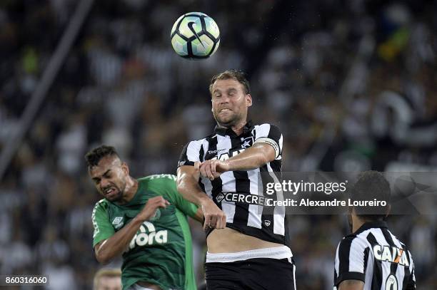 Joel Carli of Botafogo battles for the ball with Fabricio Bruno of Chapecoense during the match between Botafogo and Chapecoense as part of...